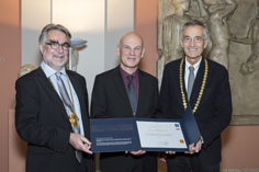 Wolfgang Dietrich being decorated as honorary professor at the University of Innsbruck, 2015.